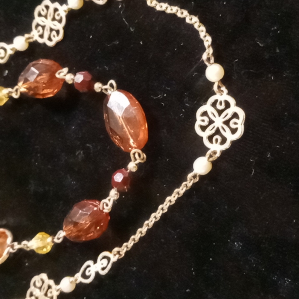 Long layered & beaded necklace .amber color & gold tones